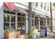Exterior view of Heavy's storefront, showcasing awning, planters, and architectural details at 2431 Settlers St, Charleston, SC 29492