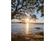 Picturesque waterfront view with a bridge in the distance and the sun reflecting on the water at 2431 Settlers St, Charleston, SC 29492