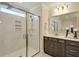 Modern bathroom with a glass-enclosed shower, marble tiles, and a sleek dark vanity at 2476 Grange Cir, Summerville, SC 29486