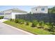 Backyard view features modern fence, green grass, and shrubs that offers both privacy and curb appeal at 262 Great Lawn Dr, Summerville, SC 29486