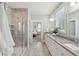 Spa-like bathroom featuring a glass shower, double sinks, and elegant tile work at 262 Great Lawn Dr, Summerville, SC 29486