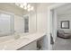 Bright bathroom featuring a quartz vanity, framed mirror and view into the adjacent room at 262 Great Lawn Dr, Summerville, SC 29486