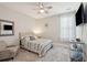 Bedroom with a ceiling fan, a bed with striped bedding, and a wall mounted TV at 262 Great Lawn Dr, Summerville, SC 29486