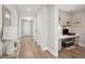 Hallway leading to the front door and an office space with built-in desk at 262 Great Lawn Dr, Summerville, SC 29486