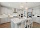 Bright kitchen with a large island, pendant lighting, stainless steel appliances, and ample counter space at 262 Great Lawn Dr, Summerville, SC 29486