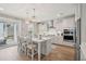 Bright kitchen with a large island, pendant lighting, stainless steel appliances, and backyard access at 262 Great Lawn Dr, Summerville, SC 29486