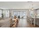 Open-concept living space with sliding glass doors and a view of the backyard and kitchen bar at 262 Great Lawn Dr, Summerville, SC 29486