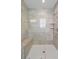 Modern glass shower with built in seat and tiled walls at 262 Great Lawn Dr, Summerville, SC 29486