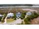 An aerial view of a neighborhood and waterfront featuring beautiful homes with stunning architecture and lush landscaping at 2705 Parkers Landing Rd, Mount Pleasant, SC 29466