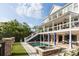 A stunning backyard with a pool, spa, covered patio, and lush landscaping for luxurious outdoor living at 2705 Parkers Landing Rd, Mount Pleasant, SC 29466