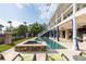 An inviting pool and spa are surrounded by lush landscaping and a covered patio space at 2705 Parkers Landing Rd, Mount Pleasant, SC 29466