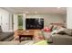 Cozy finished basement with hardwood floors, sectional sofa, and entertainment center with a large flat screen TV at 2705 Parkers Landing Rd, Mount Pleasant, SC 29466