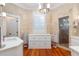 Light-filled bathroom featuring double sinks, stone walls, granite countertops and a glass shower at 2705 Parkers Landing Rd, Mount Pleasant, SC 29466