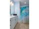 Well-lit bathroom featuring a white vanity with marble top and colorful shower curtain at 2705 Parkers Landing Rd, Mount Pleasant, SC 29466