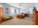 Spacious bedroom with light blue walls and carpet, furnished with tasteful wooden pieces at 2705 Parkers Landing Rd, Mount Pleasant, SC 29466