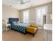 Inviting bedroom features a pineapple pattern bedspread and yellow bench at 2705 Parkers Landing Rd, Mount Pleasant, SC 29466