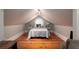 Bright bedroom featuring an arched window, hardwood floors, and neutral decor at 2705 Parkers Landing Rd, Mount Pleasant, SC 29466