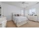 Bright bedroom with all-white decor, complemented by natural light through shuttered windows at 2705 Parkers Landing Rd, Mount Pleasant, SC 29466
