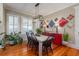 Charming dining room with a modern chandelier, bright windows, and stylish decor at 2705 Parkers Landing Rd, Mount Pleasant, SC 29466