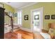 Charming foyer with stairs, wood floors, a sitting area, and white trim at 2705 Parkers Landing Rd, Mount Pleasant, SC 29466