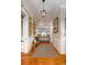 Inviting entryway featuring hardwood floors, decorative wall art, and elegant lighting at 2705 Parkers Landing Rd, Mount Pleasant, SC 29466
