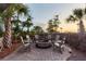 An inviting outdoor seating area surrounds a fire pit in this backyard oasis at 2705 Parkers Landing Rd, Mount Pleasant, SC 29466