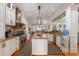 Gourmet kitchen featuring custom cabinets, stainless steel appliances, granite countertops, and an island with seating at 2705 Parkers Landing Rd, Mount Pleasant, SC 29466