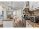 Gourmet kitchen featuring custom cabinets, stainless steel appliances, granite countertops, and an island with seating at 2705 Parkers Landing Rd, Mount Pleasant, SC 29466