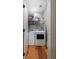 Efficient laundry room with washer, dryer, and ample shelving for storage solutions at 2705 Parkers Landing Rd, Mount Pleasant, SC 29466