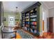 Elegant living room featuring custom shelving and bench seating, illuminated by a modern chandelier at 2705 Parkers Landing Rd, Mount Pleasant, SC 29466