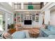 Spacious living room featuring built-in shelving, clerestory windows, and an oversized sectional sofa at 2705 Parkers Landing Rd, Mount Pleasant, SC 29466