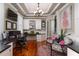 A cozy office featuring hardwood floors, a built-in desk, and natural light from plantation shutters at 2705 Parkers Landing Rd, Mount Pleasant, SC 29466