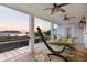 Inviting porch with dual ceiling fans and a hammock, perfect for enjoying the scenic sunset view at 2705 Parkers Landing Rd, Mount Pleasant, SC 29466