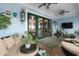 Relaxing porch with ceiling fans, comfortable seating, and plants at 2705 Parkers Landing Rd, Mount Pleasant, SC 29466