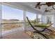 Relaxing porch featuring a hammock, ceiling fans, and serene water view beyond at 2705 Parkers Landing Rd, Mount Pleasant, SC 29466