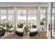 Bright sunroom featuring comfortable wicker seating, lots of windows, and beautiful views at 2705 Parkers Landing Rd, Mount Pleasant, SC 29466