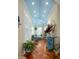 Inviting sunroom with a vaulted ceiling, many windows, and charming furniture, perfect for relaxation and enjoying natural light at 2705 Parkers Landing Rd, Mount Pleasant, SC 29466