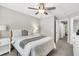 Bedroom with a plush bed, ceiling fan, and closet access at 271 Jackson St, Goose Creek, SC 29445