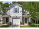 Gray townhouse featuring a one-car garage and well-manicured front lawn at 271 Jackson St, Goose Creek, SC 29445