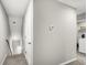 Hallway featuring stairs to the lower level and a laundry area at 271 Jackson St, Goose Creek, SC 29445