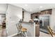 Kitchen area featuring wood cabinets, stainless steel appliances, and bar seating at 271 Jackson St, Goose Creek, SC 29445