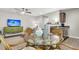 Living room area with dining table and television set at 271 Jackson St, Goose Creek, SC 29445