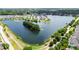 Scenic aerial view of the lake surrounded by lush greenery with a walking path near the lake at 2746 Sunrose Ln, Johns Island, SC 29455