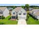 Aerial view of home showcasing the surrounding landscape, neighborhood, and manicured lawn at 2746 Sunrose Ln, Johns Island, SC 29455