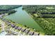 Gorgeous aerial view of the lake surrounded by lush greenery and stunning homes at 2746 Sunrose Ln, Johns Island, SC 29455