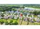Beautiful aerial view of the neighborhood featuring picturesque homes and a serene lake at 2746 Sunrose Ln, Johns Island, SC 29455