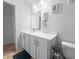 Clean bathroom with white vanity, framed mirror, and essential toiletry storage at 2746 Sunrose Ln, Johns Island, SC 29455