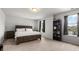 Spacious bedroom with neutral carpet, a bookcase, and bright windows at 2746 Sunrose Ln, Johns Island, SC 29455