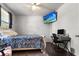 Bedroom with hardwood floors, a work desk, and a ceiling fan, offering a comfortable living space at 2746 Sunrose Ln, Johns Island, SC 29455