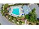 Aerial view of the community pool with lounge chairs and an umbrella, ideal for relaxation at 2746 Sunrose Ln, Johns Island, SC 29455